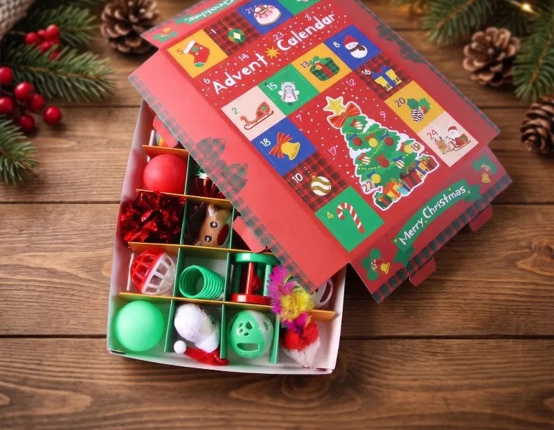 The calendar open, with a toy in each compartment